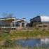 Aquamundo Wasserpark mit wellenförmiger Dachkonstruktion und Holz-Stahl-Hybridbauweise in Dänemark